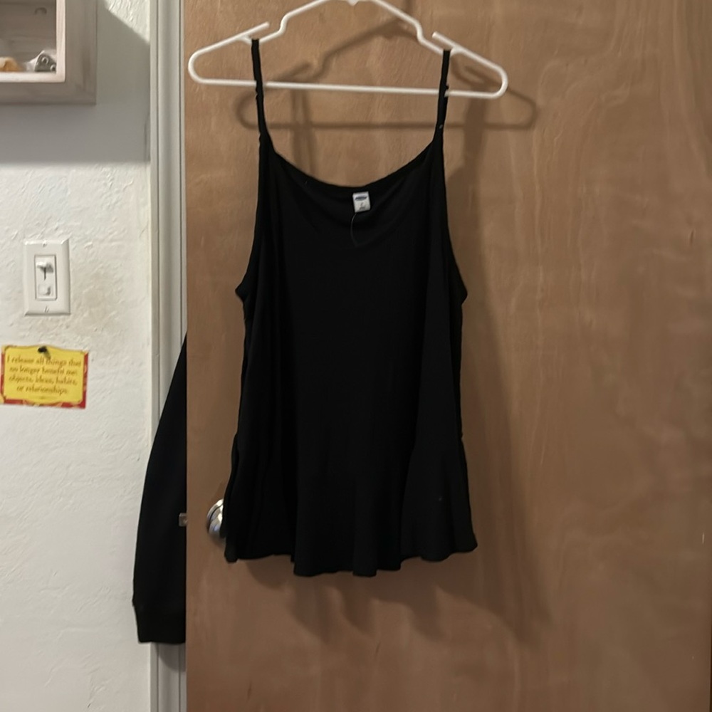 Black tank top with ruffle detail at bottom